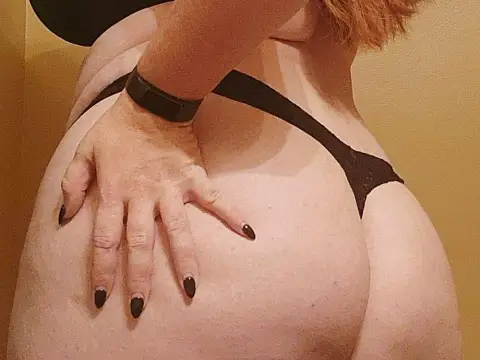 Redheaded milf with a breeding kink